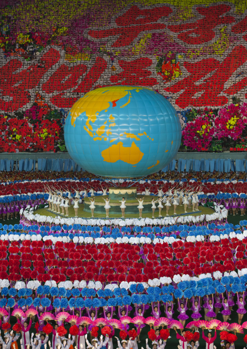 North Korean dancers in front of a world globe during the Arirang mass games in may day stadium, Pyongan Province, Pyongyang, North Korea