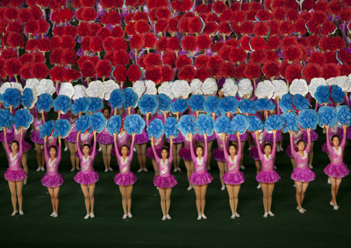 North Korean gymnasts holiding flowers during Arirang mass games in may day stadium, Pyongan Province, Pyongyang, North Korea