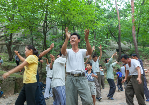 North Korean electricity company workers dancing in a park, North Hwanghae Province, Kaesong, North Korea