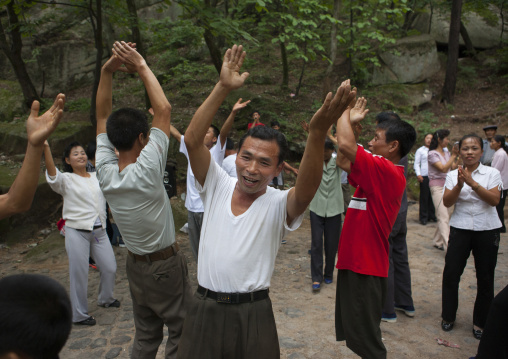 North Korean electricity company workers dancing in a park, North Hwanghae Province, Kaesong, North Korea