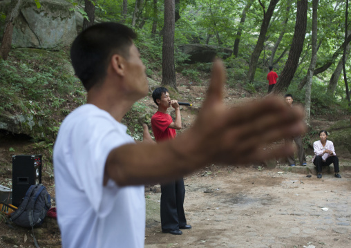 North Korean electricity company workers dancing in a park, North Hwanghae Province, Kaesong, North Korea