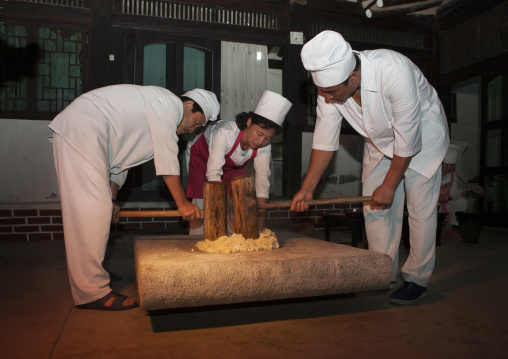 North Korean cooks banging rice in a restaurant, North Hwanghae Province, Kaesong, North Korea