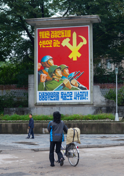 Workers' Party of North Korea propaganda billboard saying protect at the risk of our lives the central committee of the Party whose leader is the great comrade Kim jong-un!, North Hwanghae Pr