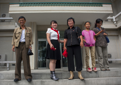 North Korean family going out of a luxury restaurant, Pyongan Province, Pyongyang, North Korea
