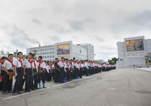 North Korean pioneers going to pay respect to the Dear Leaders at Mansudae art studio, Pyongan Province, Pyongyang, North Korea