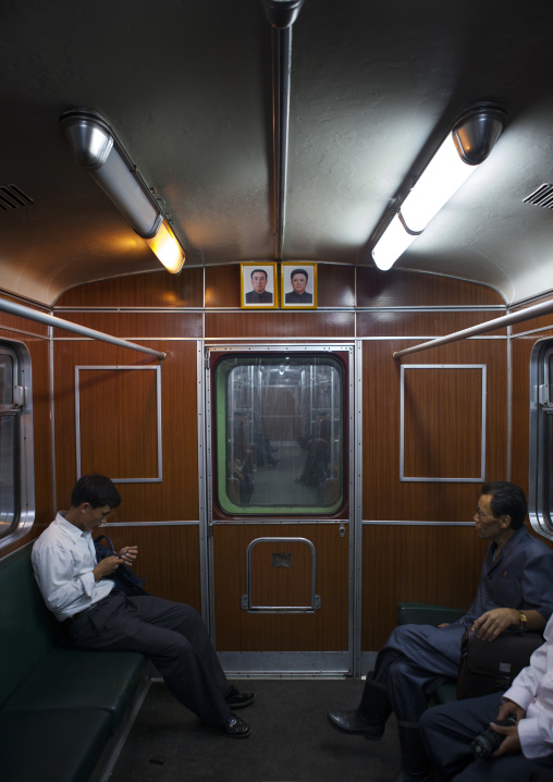 Official portraits of the Dear Leaders in a subway wagon, Pyongan Province, Pyongyang, North Korea