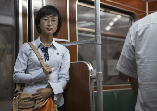 Young North Korean woman inside a subway train, Pyongan Province, Pyongyang, North Korea