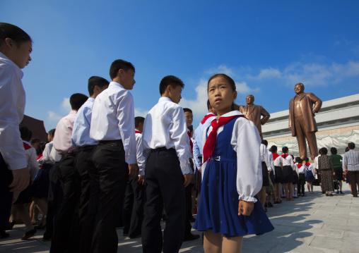 North Korean pioneers paying respect to the two statues of the Dear Leaders in the Grand monument on Mansu hill, Pyongan Province, Pyongyang, North Korea