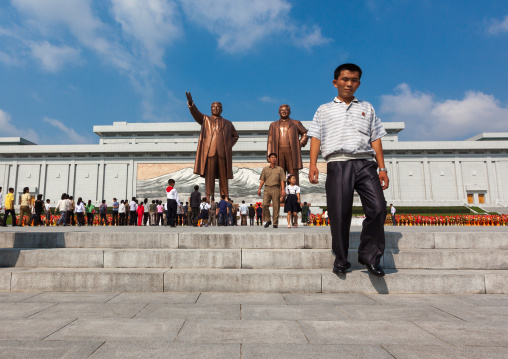 North Korean people in front of the statues of the Dear Leaders in Mansudae Grand monument, Pyongan Province, Pyongyang, North Korea