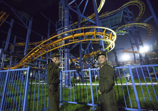 North Korean soldiers in front of a roller coaster at Kaeson youth park, Pyongan Province, Pyongyang, North Korea