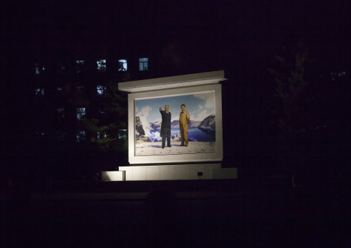 Kim il Sung and Kim Jong il on a propaganda mosaic fresco at night, Kangwon Province, Wonsan, North Korea