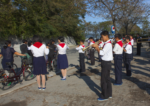 North Korean pioneers playing music in the street, Kangwon Province, Wonsan, North Korea