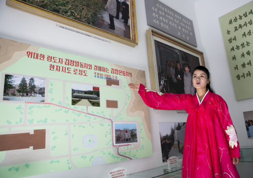 North Korean guide in red choson-ot dress in the agriculture university, South Hamgyong Province, Hamhung, North Korea