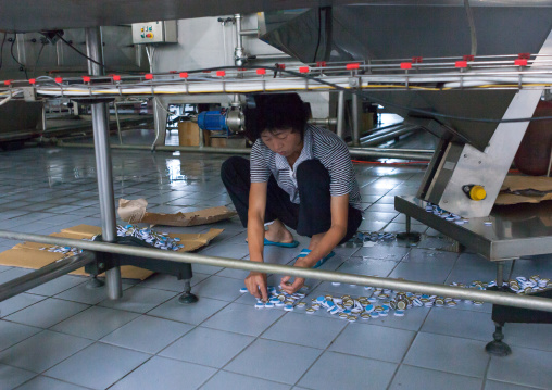 North Korean female worker in kangso yaksu mineral water factory, South Pyongan Province, Nampo, North Korea