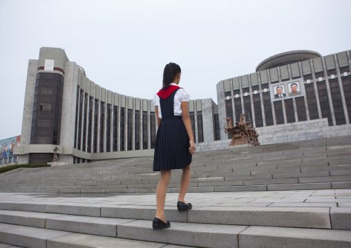 North Korean pioneer girl on the stairs of the Mangyongdae children's palace, Pyongan Province, Pyongyang, North Korea