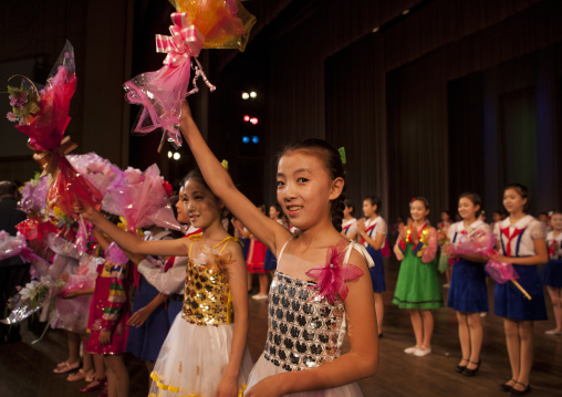 Young North Korean artists with flowers at the end of their show in Mangyongdae children's palace, Pyongan Province, Pyongyang, North Korea