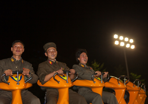 North Korean soldiers in a fairground attraction at Kaeson youth park, Pyongan Province, Pyongyang, North Korea