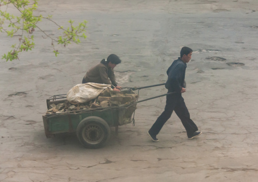 North Korean people pushing cart, North Hamgyong Province, Chongjin, North Korea