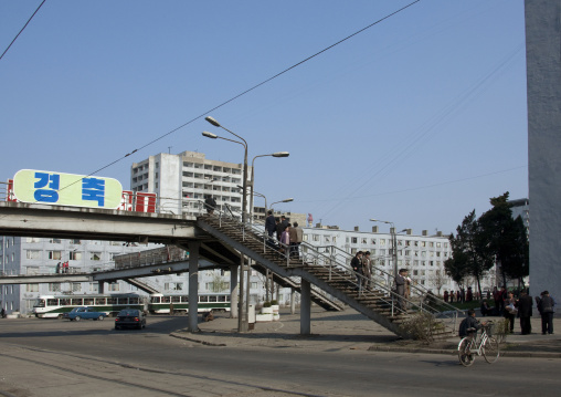North Korean pedestrians using a footbridge in the city, Pyongan Province, Pyongyang, North Korea