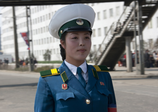 North Korean traffic security officer in blue uniform in the street, Pyongan Province, Pyongyang, North Korea
