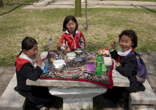 North Korean pioneers having a picnic in a park, Pyongan Province, Pyongyang, North Korea