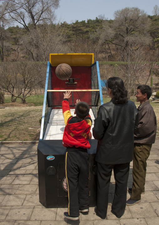 North Korean people playing basketball game at Taesongsan funfair, Pyongan Province, Pyongyang, North Korea