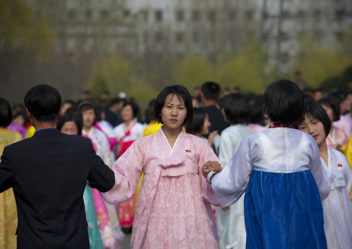 North Korean young adults during a mass dance performance in front of buildings on military foundation day, Pyongan Province, Pyongyang, North Korea