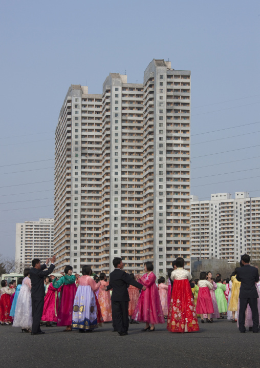 North Korean young adults during a mass dance performance in front of buildings on military foundation day, Pyongan Province, Pyongyang, North Korea