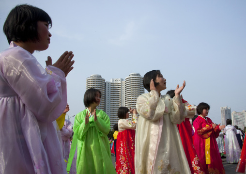 North Korean young adults during a mass dance performance in front of buildings on military foundation day, Pyongan Province, Pyongyang, North Korea