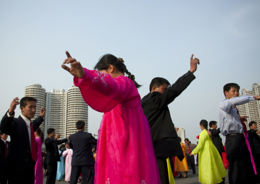 North Korean young adults during a mass dance performance in front of buildings on military foundation day, Pyongan Province, Pyongyang, North Korea