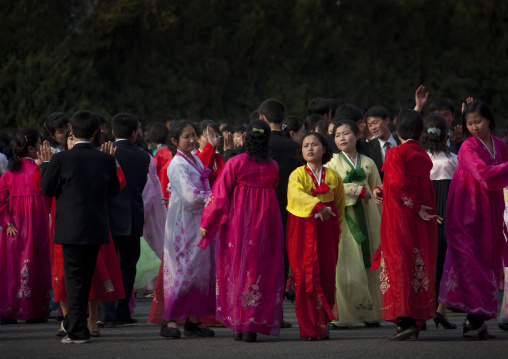 North Korean young adults during a mass dance performance in front of buildings on military foundation day, Pyongan Province, Pyongyang, North Korea