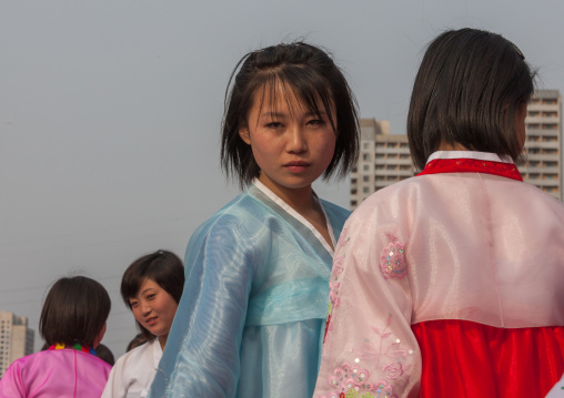 North Korean young adults during a mass dance performance in front of buildings on military foundation day, Pyongan Province, Pyongyang, North Korea