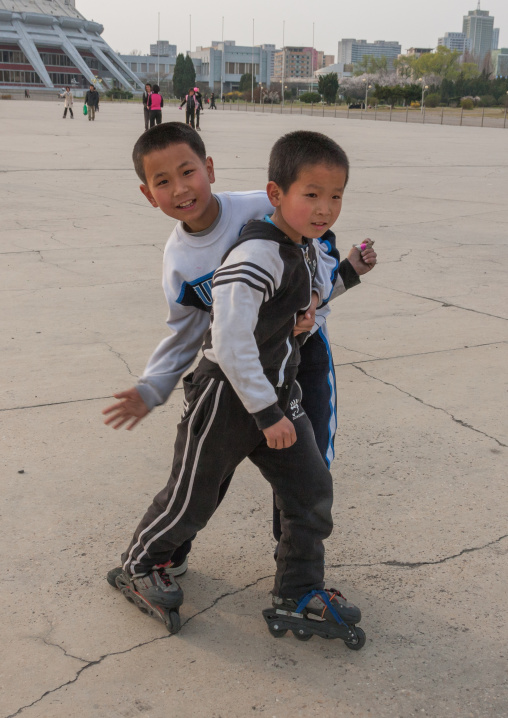 North Korean boys roller skating on a square, Pyongan Province, Pyongyang, North Korea