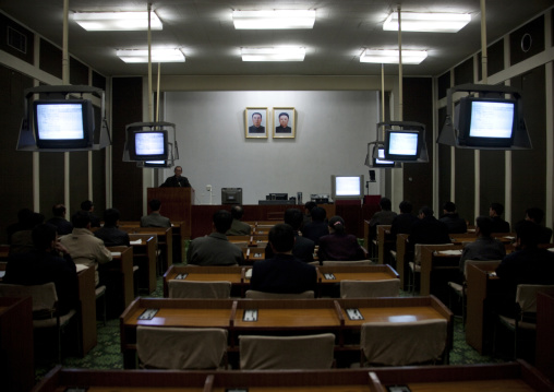 English classroom in Grand people's study house with official portraits of the Dear Leaders on the wall, Pyongan Province, Pyongyang, North Korea