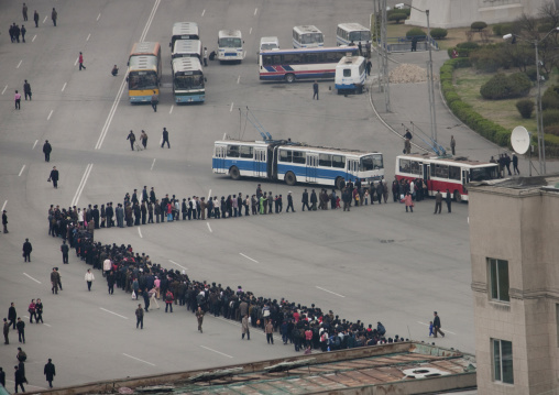 Crowd of North Korean people queueing in line for a bus, Pyongan Province, Pyongyang, North Korea