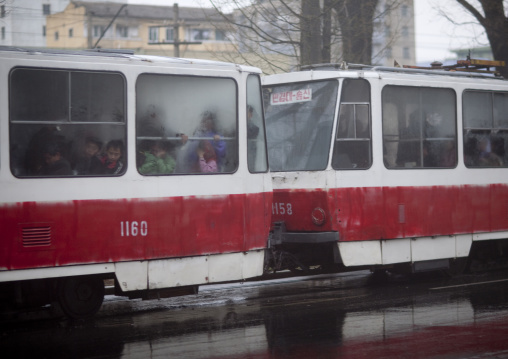 Old North Korean red tramway in bad condition under the rain, Pyongan Province, Pyongyang, North Korea