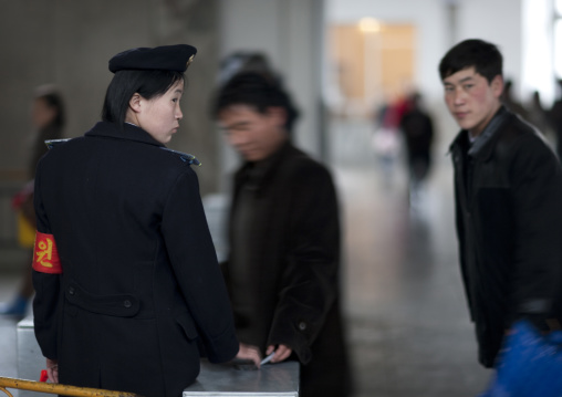 North Korean subway employee in front of a tickets machine, Pyongan Province, Pyongyang, North Korea