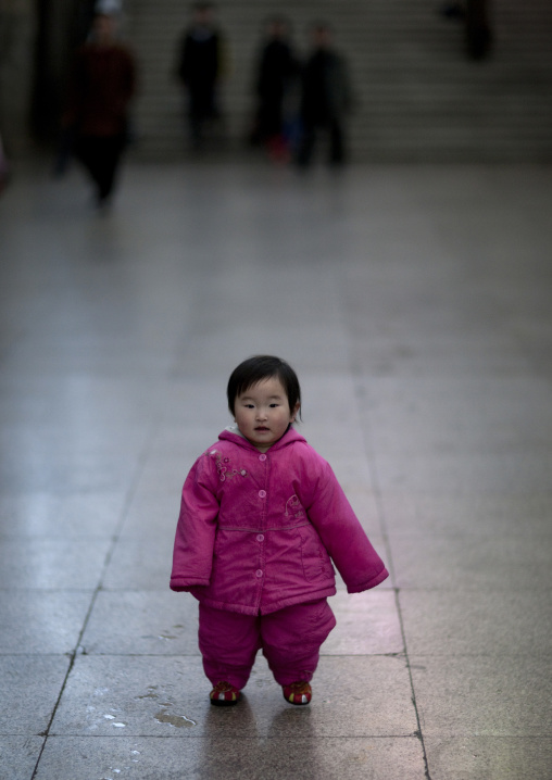 North Korean toddler in pink clothes in the subway, Pyongan Province, Pyongyang, North Korea