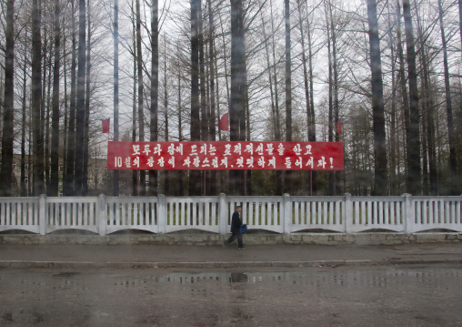 Propaganda slogan on a red billboard in town, North Hwanghae Province, Kaesong, North Korea