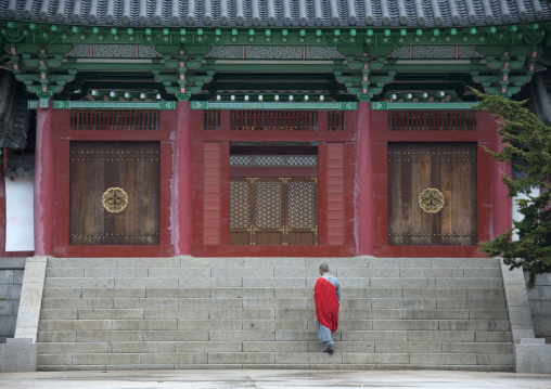 North Korean monk in front of Ryongthong temple founded by Korean chonthae sect of buddhism, Ogwansan, Ryongthong Valley, North Korea
