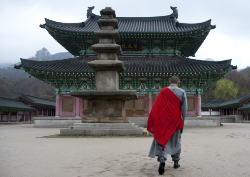 North Korean monk in front of Ryongthong temple founded by Korean chonthae sect of buddhism, Ogwansan, Ryongthong Valley, North Korea