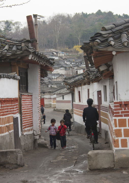North Korean people walking in a street in the old town, North Hwanghae Province, Kaesong, North Korea