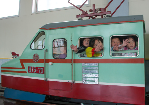 North Korean children having fun in a fake locomotive at Kwangbok primary school, Pyongan Province, Pyongyang, North Korea
