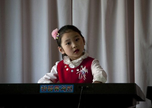 Young North Korean girl playing piano in Kwangbok school, Pyongan Province, Pyongyang, North Korea