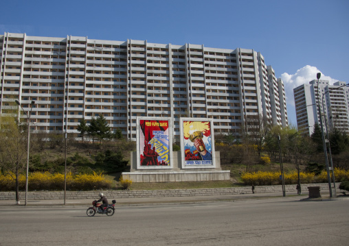 North Korean propaganda billboards in the street in front of buildings, Pyongan Province, Pyongyang, North Korea