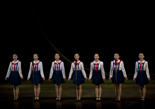 North horean pioneers girls singing during a show at Mangyongdae children's palace, Pyongan Province, Pyongyang, North Korea