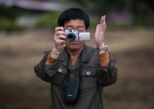 North Korean man taking pictures with a canon digital camera, Hyangsan county, Mount Myohyang, North Korea