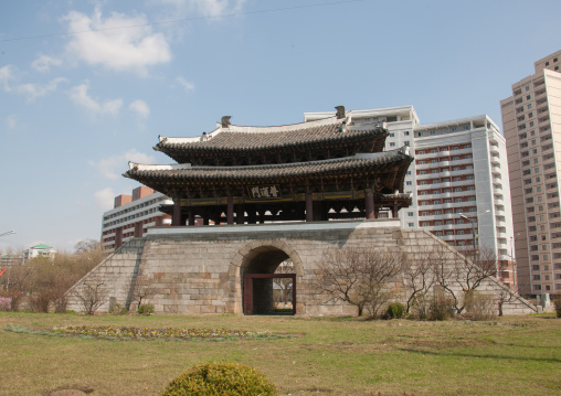 Old city gate in front of modern buildings, Pyongan Province, Pyongyang, North Korea