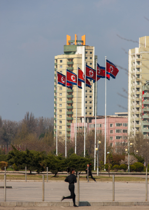 North Korean people running in the middle of buildings, Pyongan Province, Pyongyang, North Korea