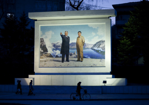 Kim il Sung and Kim Jong il on a propaganda mosaic fresco at night, Kangwon Province, Wonsan, North Korea
